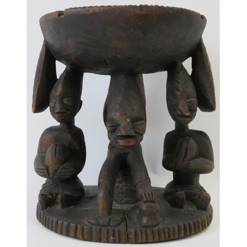 261 - Tribal Art: A Kola nut carved wood offering stand, Yoruba Tribe. Carved depicting three figures supp... 