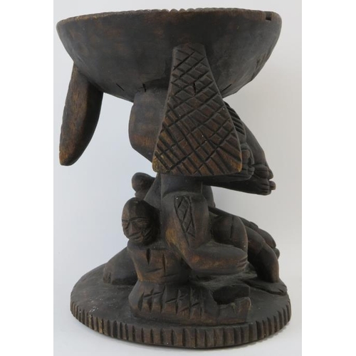 261 - Tribal Art: A Kola nut carved wood offering stand, Yoruba Tribe. Carved depicting three figures supp... 