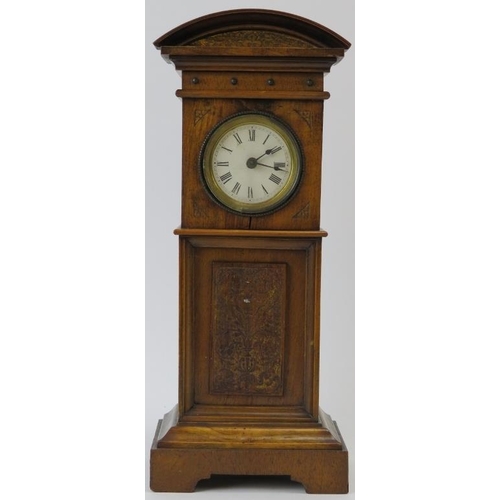 266 - Miniature long case clock, walnut, traces of gilding to etched panel, not tested, 18cm height. 
Cond... 