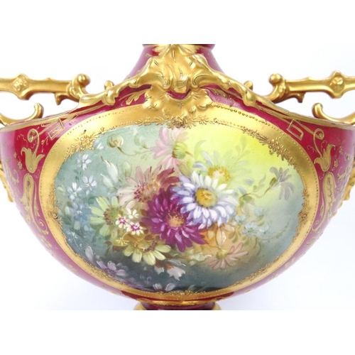 3 - A European twin handled floral and gilt decorated vase, 19th century. Probably German manufactured. ... 