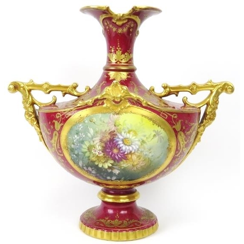 3 - A European twin handled floral and gilt decorated vase, 19th century. Probably German manufactured. ... 