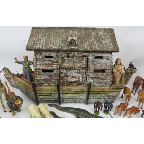 30 - A hand crafted Noah’s Ark and collection of model animals. The models are mostly cold painted metal ... 