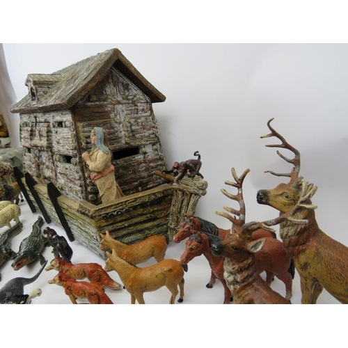 30 - A hand crafted Noah’s Ark and collection of model animals. The models are mostly cold painted metal ... 