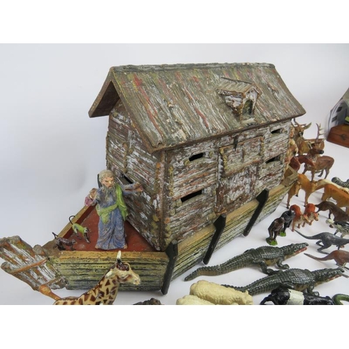 30 - A hand crafted Noah’s Ark and collection of model animals. The models are mostly cold painted metal ... 