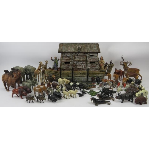 30 - A hand crafted Noah’s Ark and collection of model animals. The models are mostly cold painted metal ... 