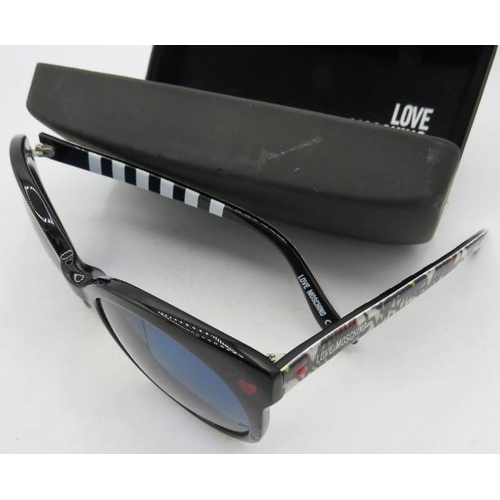 302 - A pair of Love Moschino black sunglasses with patterned arms, marked ML53S01SA 55 20 140, cased.
Con... 