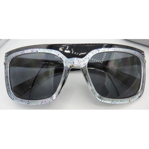 303 - A pair of Calvin Klein sunglasses with splattered arms and marked FIFTYFIVEDBL, cased.
Condition rep... 