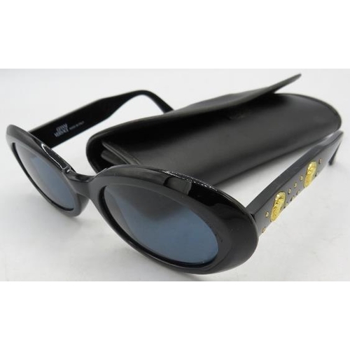 304 - A pair of Gianni Versace black sunglasses with gold coloured insets on the arms, MOD 527/B COL 852BK... 