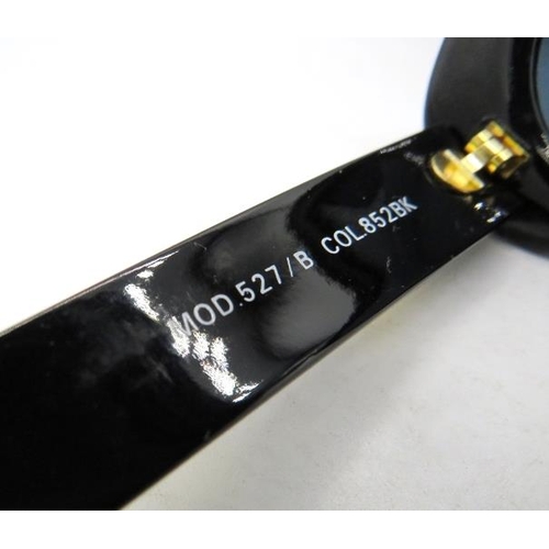 304 - A pair of Gianni Versace black sunglasses with gold coloured insets on the arms, MOD 527/B COL 852BK... 