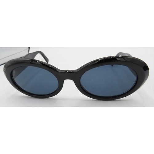 304 - A pair of Gianni Versace black sunglasses with gold coloured insets on the arms, MOD 527/B COL 852BK... 