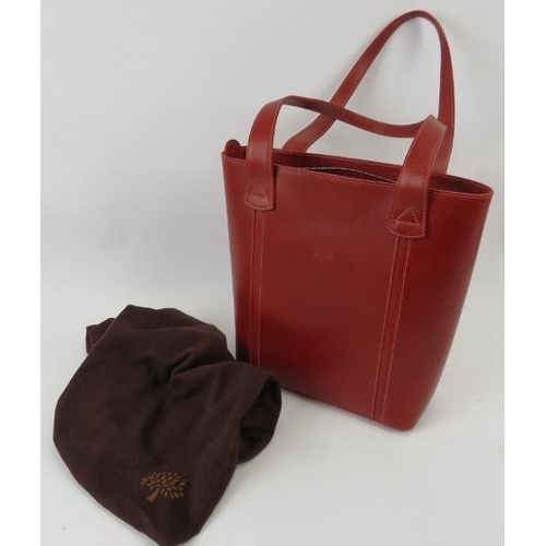 319 - A red Mulberry handbag with plaid lining, 196543.
Condition report: Good condition.