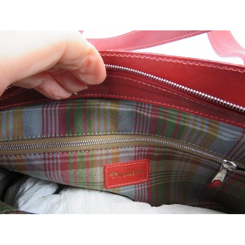 319 - A red Mulberry handbag with plaid lining, 196543.
Condition report: Good condition.