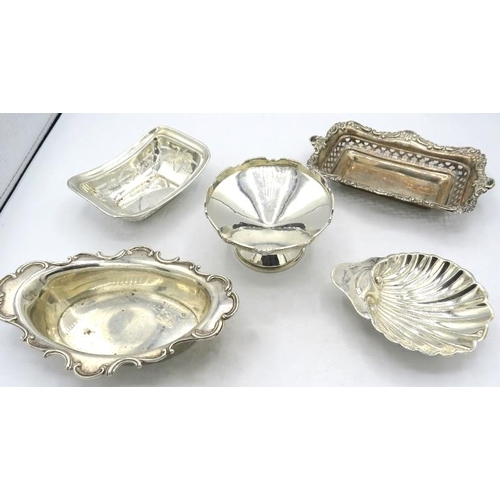 330 - An assortment of five silver bon bon dishes, to include a rectangular one with embossed & pierced de... 