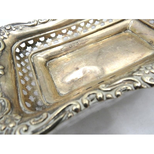 330 - An assortment of five silver bon bon dishes, to include a rectangular one with embossed & pierced de... 