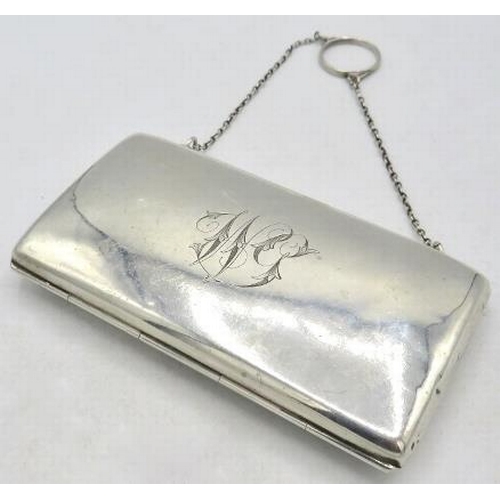 333 - A silver rectangular purse on a chain, Birmingham 1912, monogrammed, with green silk liner. Approx 5... 