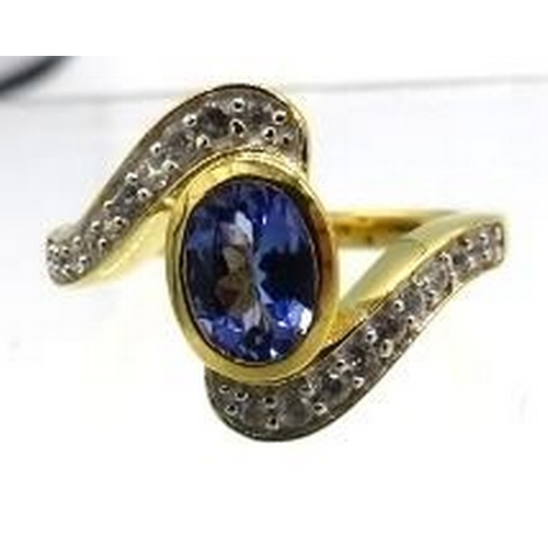 340 - Bezel set Tanzanite bypass design ring.  Vermeil 18K yellow gold overlay sterling silver, stamped 92... 