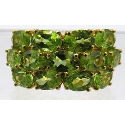 350 - Peridot ring. Oval faceted 6 x 4mm stones of good colour, cut & clarity, size N/O.  Vermeil 18K yell... 