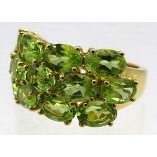 350 - Peridot ring. Oval faceted 6 x 4mm stones of good colour, cut & clarity, size N/O.  Vermeil 18K yell... 