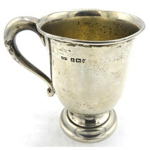 363 - A silver Christening mug on a pedestal foot, monogrammed, Birmingham 1927, approx 3 1/2