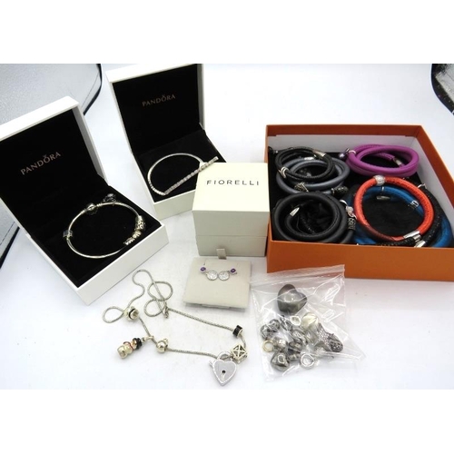 377 - A collection of 7 various wrap around leather, satin and shark skin bracelets with 27 various charms... 