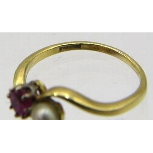 391 - A 9ct yellow gold cross over ruby & pearl ring, size L. Approx weight 2.3 grams.
Condition report: S... 