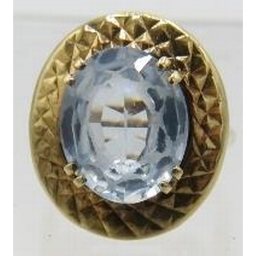 405 - A yellow metal pale blue topaz set ring. Topaz approx 12mm x 10mm, size H, marks worn. Approx weight... 