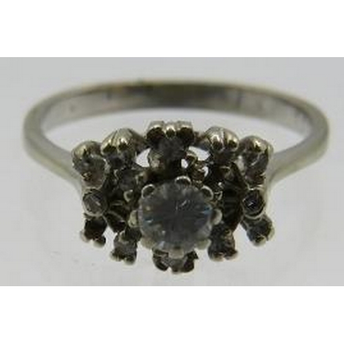 408 - A 935 marked silver ring set with centre diamond surrounded by 11 diamonds, (one diamond missing). C... 