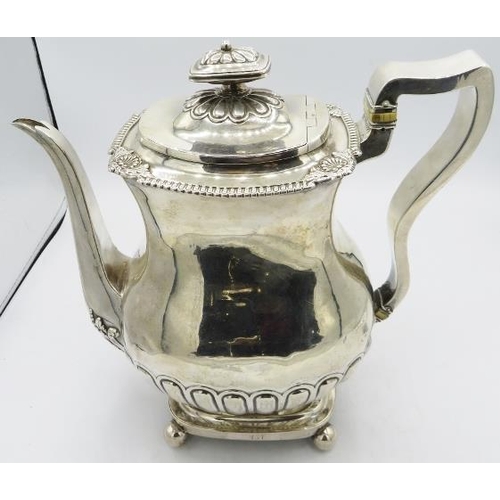 421 - A heavy Georgian silver teapot on rectangular pedestal foot on ball feet with ivory insulators, Newc... 