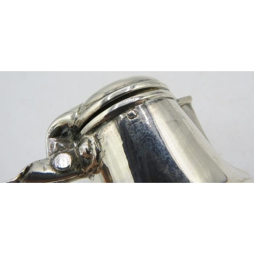 430 - A small French silver lidded cream jug. Approx weight 2.3 troy oz/72 grams.
Condition report: Dents ... 