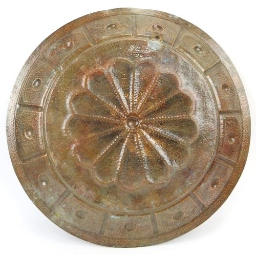 45 - A large Portuguese planished copper charger by F Cunha. Signed and dated 95 to the reverse. The craf... 