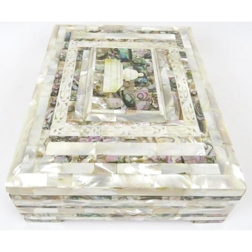 47 - A mother of pearl and abalone shell jewellery box, early 20th century. Of rectangular form with a ca... 