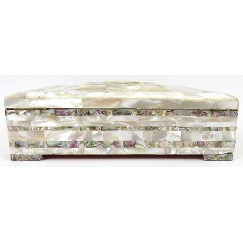 47 - A mother of pearl and abalone shell jewellery box, early 20th century. Of rectangular form with a ca... 