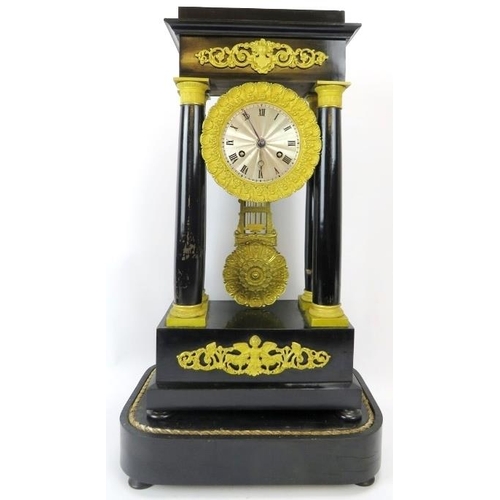 50 - A French ebonised and ormolu mounted Portico clock, 19th century. With four tapered columns, the dia... 