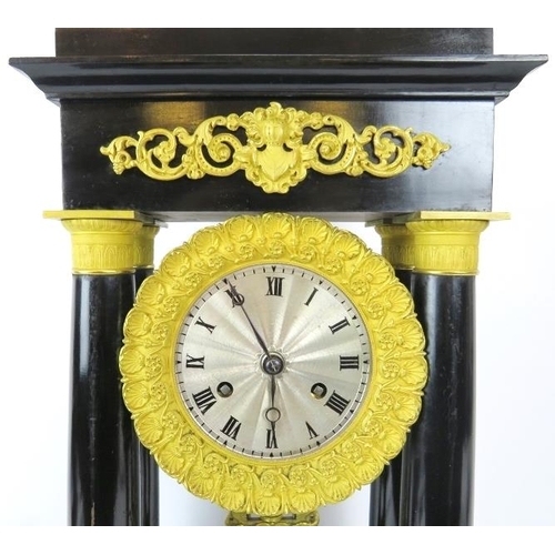 50 - A French ebonised and ormolu mounted Portico clock, 19th century. With four tapered columns, the dia... 