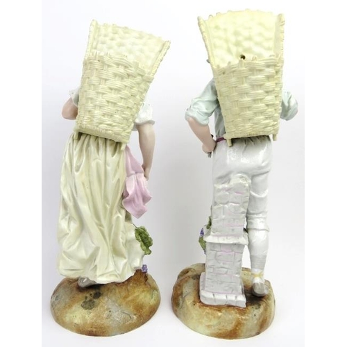 57 - A large pair of German porcelain figurines, late 19th/20th century. Hand painted with gilt highlight... 