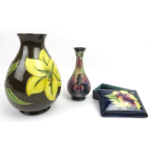 59 - A group of three Walter Moorcroft and later items. Comprising a Walter Moorcroft Bermuda lily patter... 