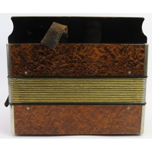 67 - A Hohner melodeon, circa 1940s. Modelled with a simulated burr walnut exterior. 7.3 in (18.5 cm) app... 