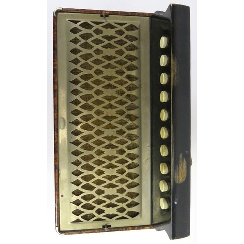 67 - A Hohner melodeon, circa 1940s. Modelled with a simulated burr walnut exterior. 7.3 in (18.5 cm) app... 