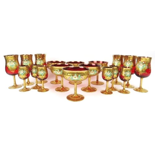 7 - Three sets of six Venetian ruby red glasses with gilt decoration, 20th century. Comprising six wine ... 