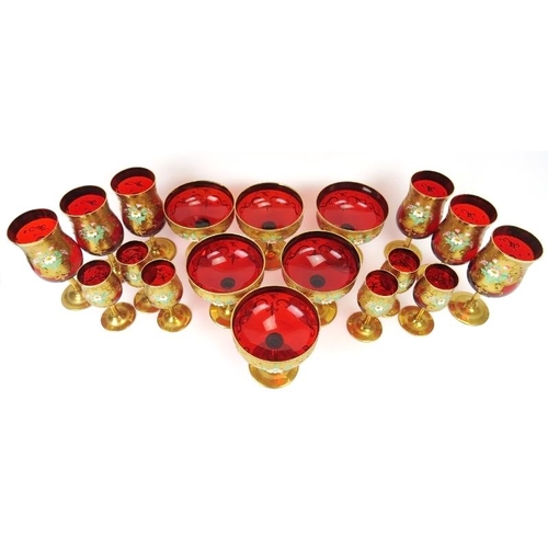 7 - Three sets of six Venetian ruby red glasses with gilt decoration, 20th century. Comprising six wine ... 