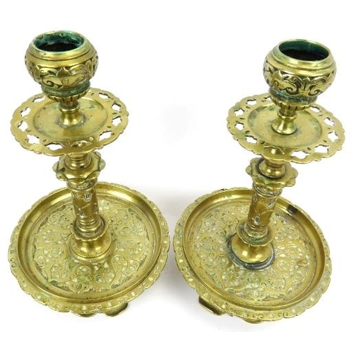 70 - A pair of Victorian brass candlesticks, 19th/early 20th century. Of a typical overall Dutch form wit... 