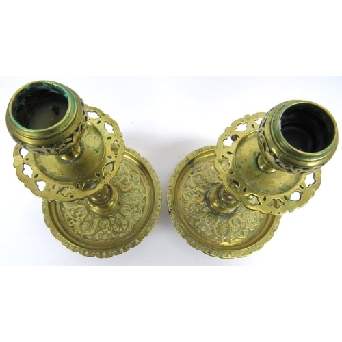 70 - A pair of Victorian brass candlesticks, 19th/early 20th century. Of a typical overall Dutch form wit... 