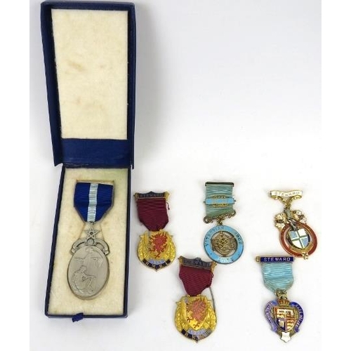 72 - A collection of Masonic items. Including two enamelled silver gilt medals, a silver medal of oval fo... 