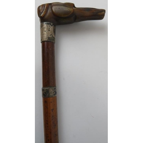 96 - Two Edwardian walking canes. Comprising a walking cane with a tapered shaft mounted with two silver ... 