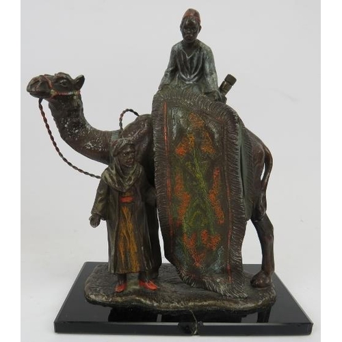 97 - A novelty cold painted spelter desk top lighter. Modelled in Bergman style in the form of a camel wi... 