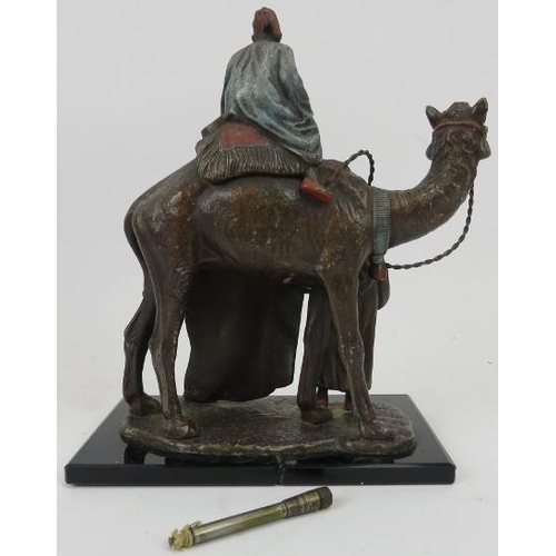 97 - A novelty cold painted spelter desk top lighter. Modelled in Bergman style in the form of a camel wi... 