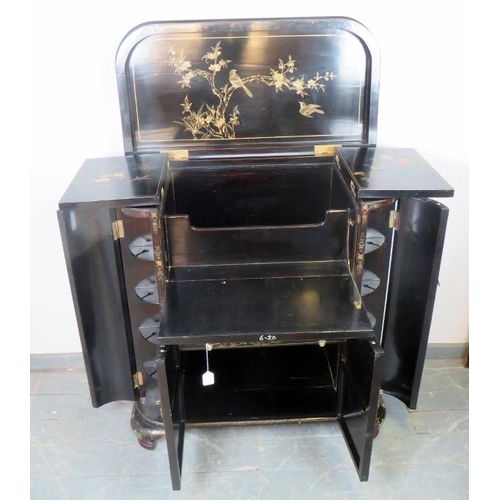 704 - A vintage Chinese black lacquered drinks cabinet, with hand painted motifs depicting songbirds and l... 