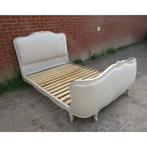 706 - A vintage French kingsize double bed, the carved frame painted distressed grey, with padded head and... 