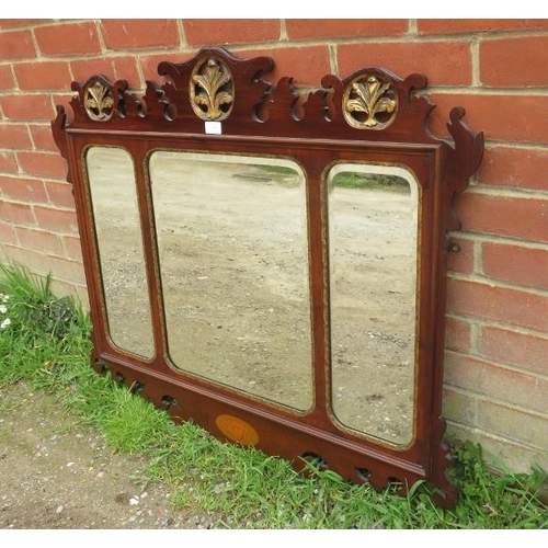 707 - A Georgian mahogany parcel gilt triptych bevelled wall mirror, within a shaped surround featuring ca... 