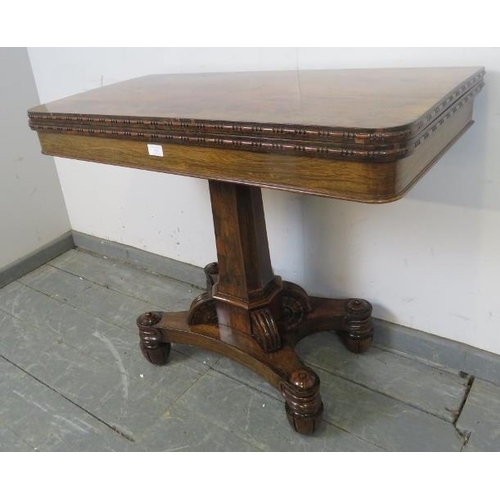 725 - A Victorian rosewood turnover card table with inset green baize, on a tapering octagonal column abov... 